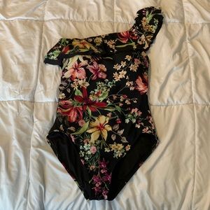 Never worn. One piece floral swimsuit size 8